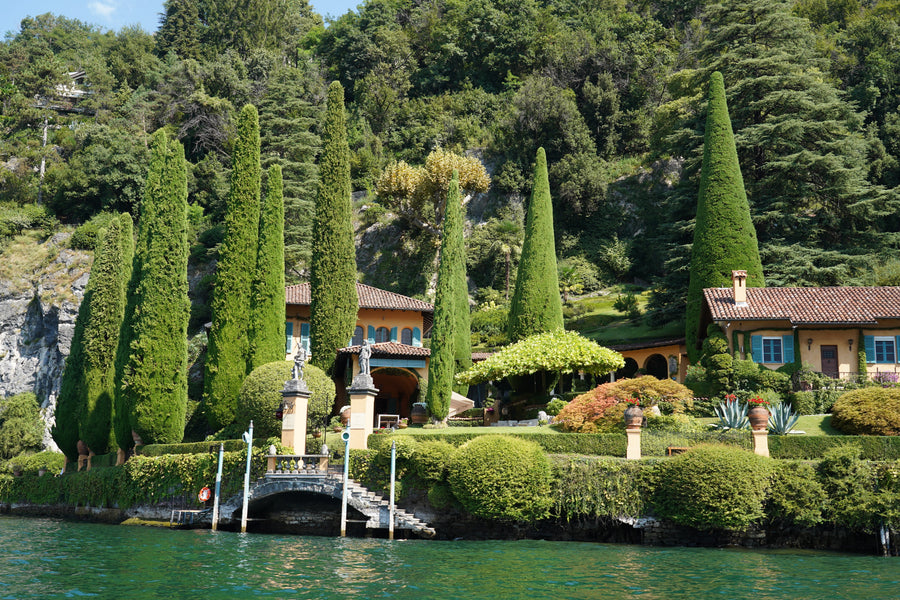 Lake Como fine art photograph of a lakeside villa with cypress trees and still green water