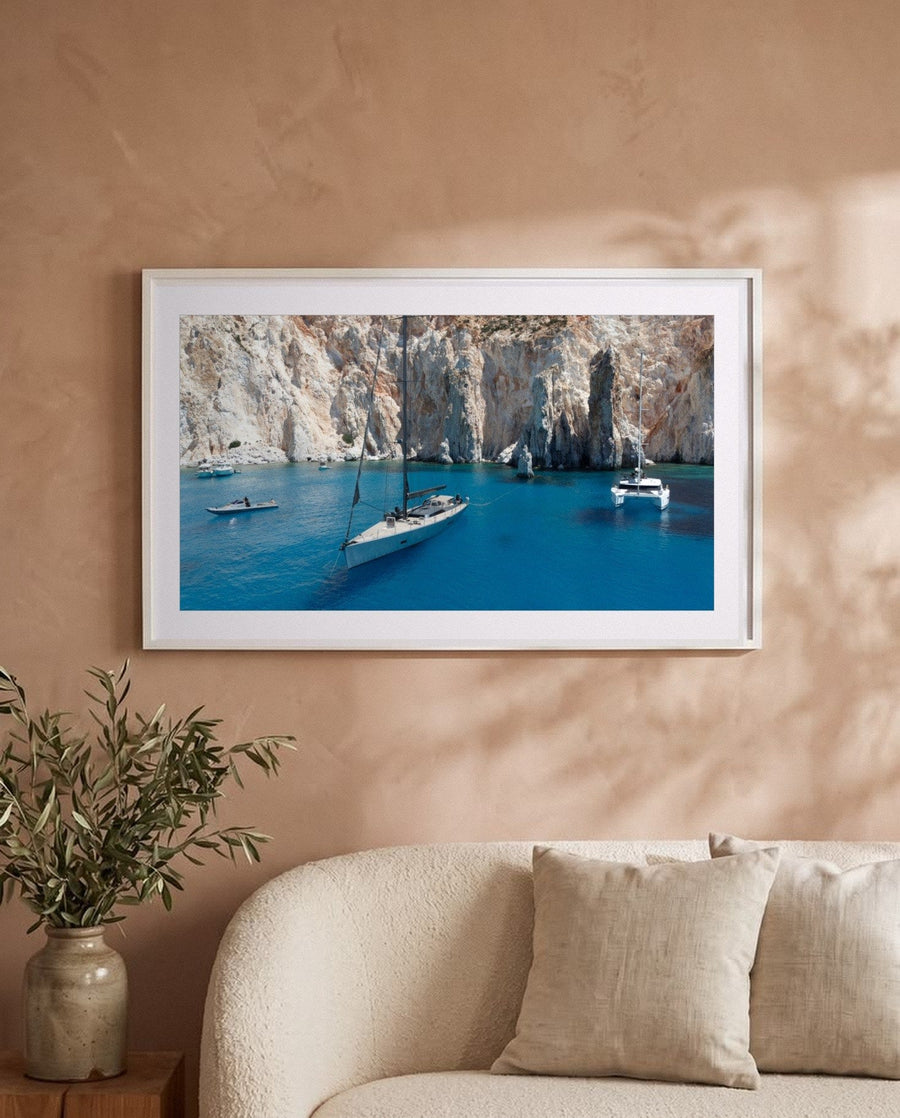 Ocean Blues, framed on a warm plaster wall