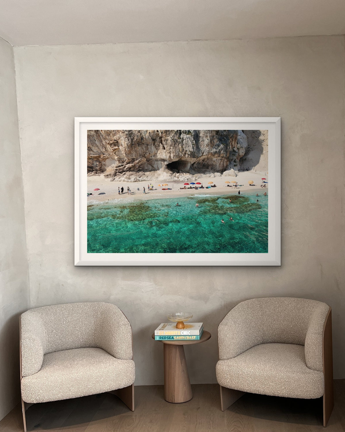 Mock-up: a framed Contemplo Sardinia print hung above two armchairs