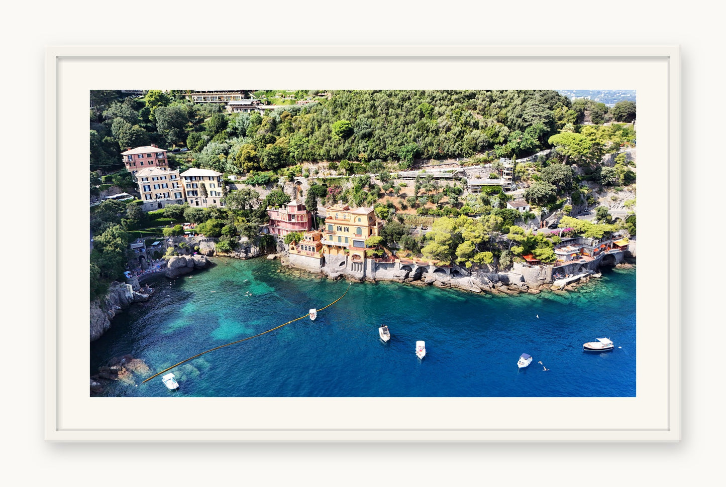 
                  
                    Hidden Bay, Portofino, framed in white with a 5 cm white border, shown at 66 x 87 cm
                  
                
