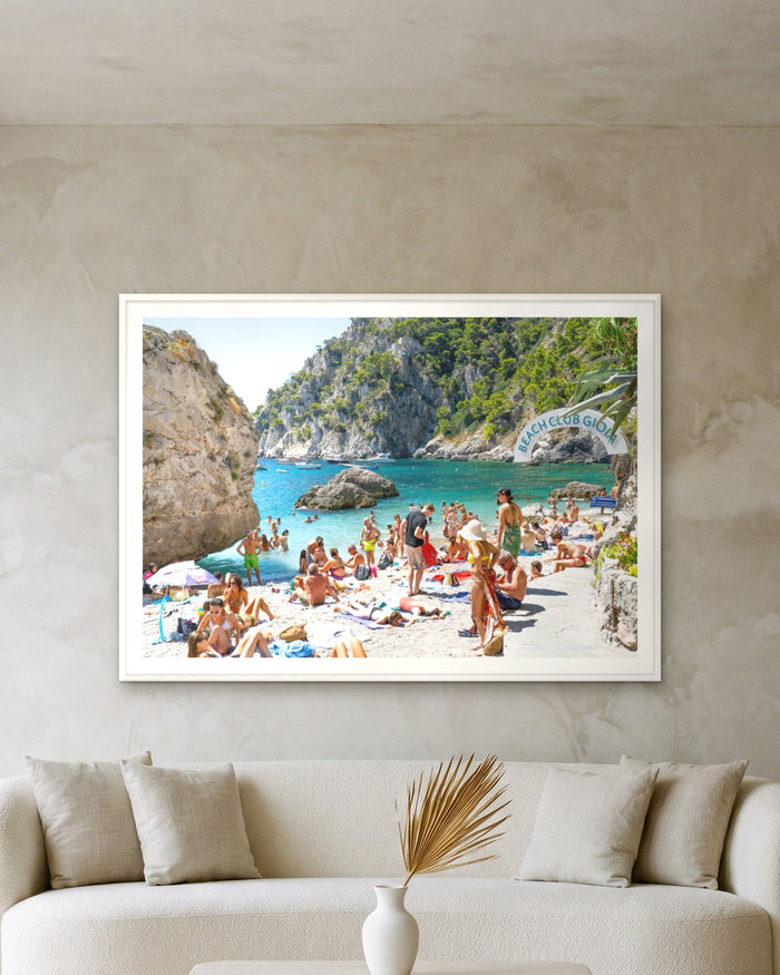 Gioia Beach Club, framed on a textured plaster wall