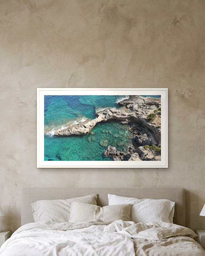 The Arch, Sardinia, framed on a textured plaster wall