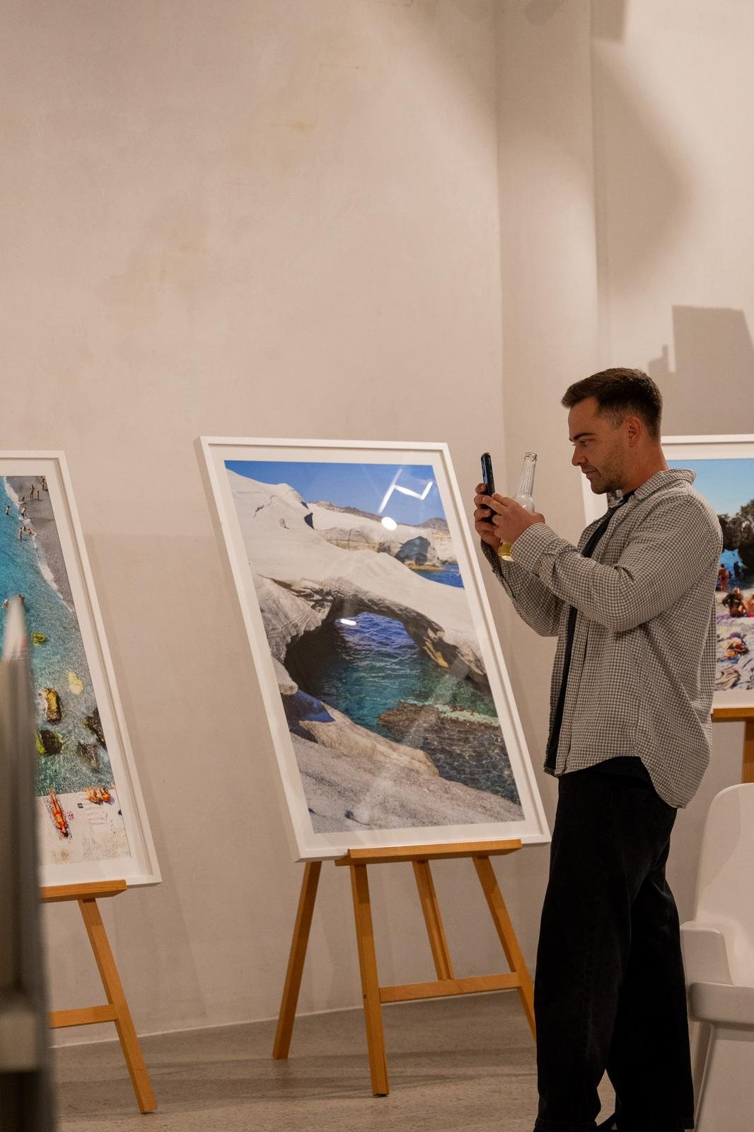 A guest viewing a framed Contemplo print
