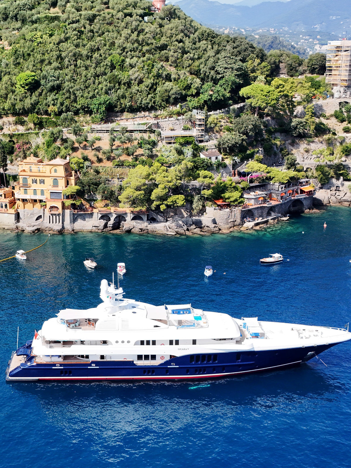 Superyacht at anchor below the villas of Portofino