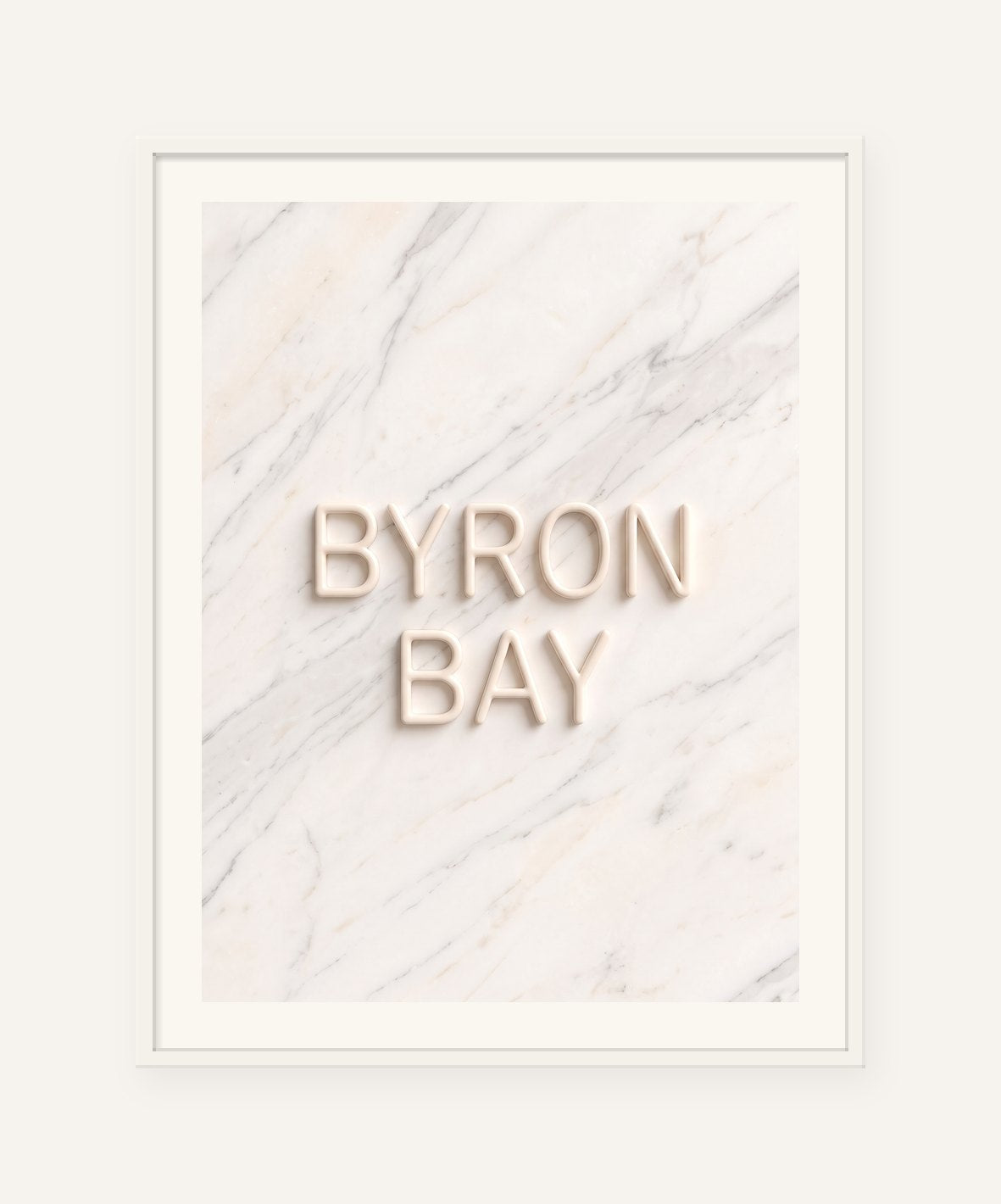 
                  
                    Byron Bay, the word carved into soft marble, framed in white with a 5 cm white border
                  
                