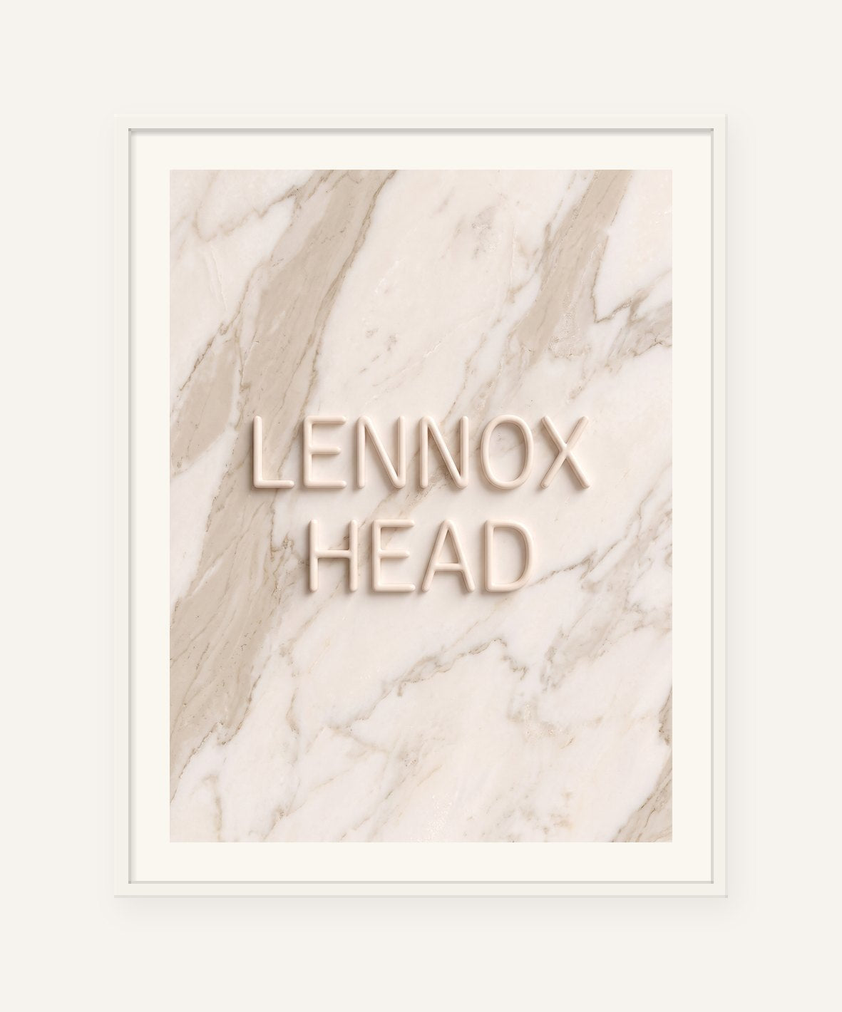 
                  
                    Lennox Head, the word carved into soft marble, framed in white with a 5 cm white border
                  
                
