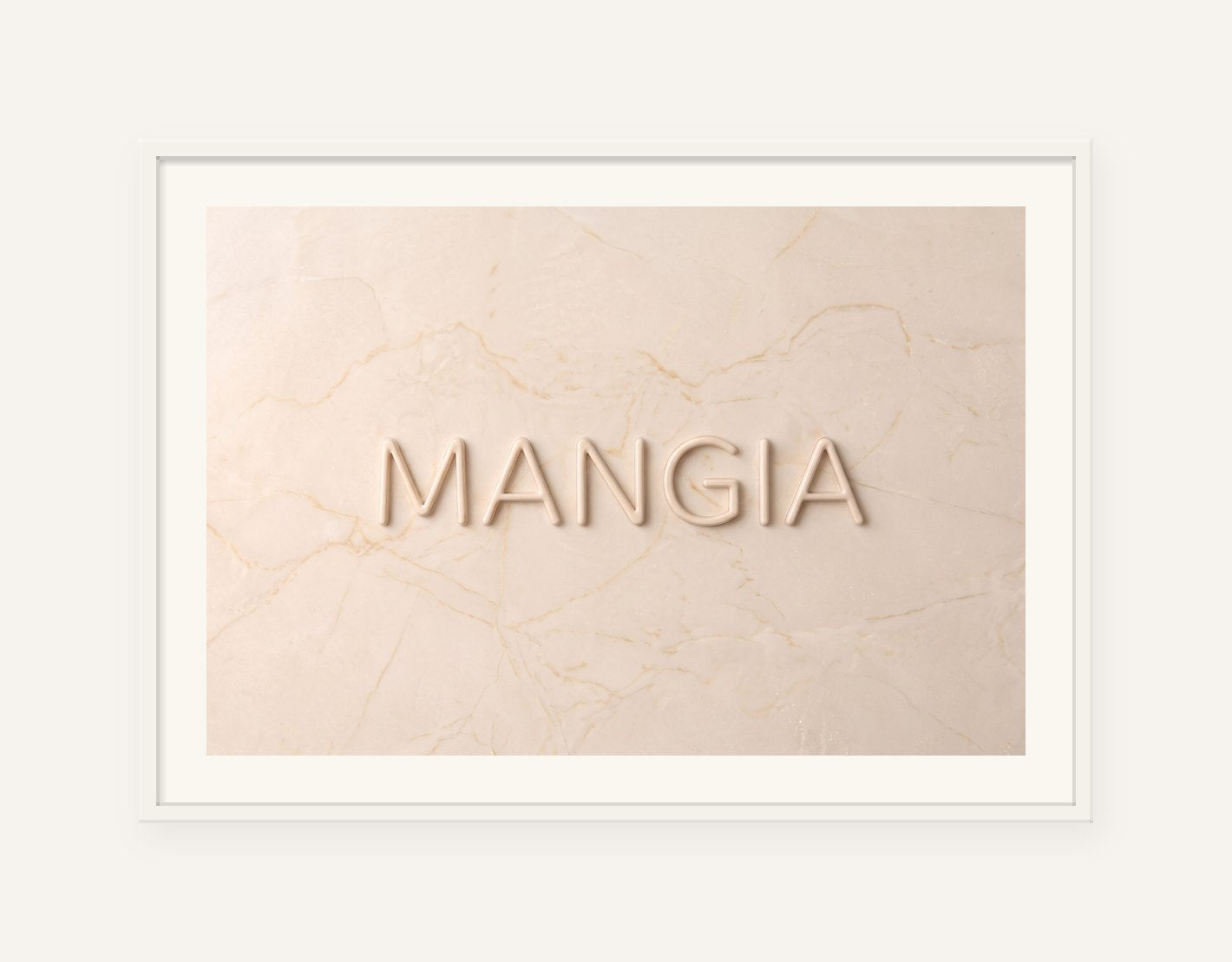 
                  
                    Mangia, the word carved into soft marble, framed in white with a 5 cm white border
                  
                