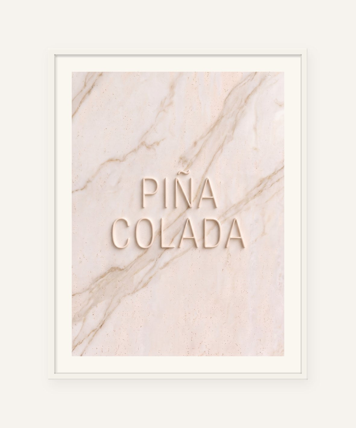 
                  
                    Piña Colada, the word carved into soft marble, framed in white with a 5 cm white border
                  
                